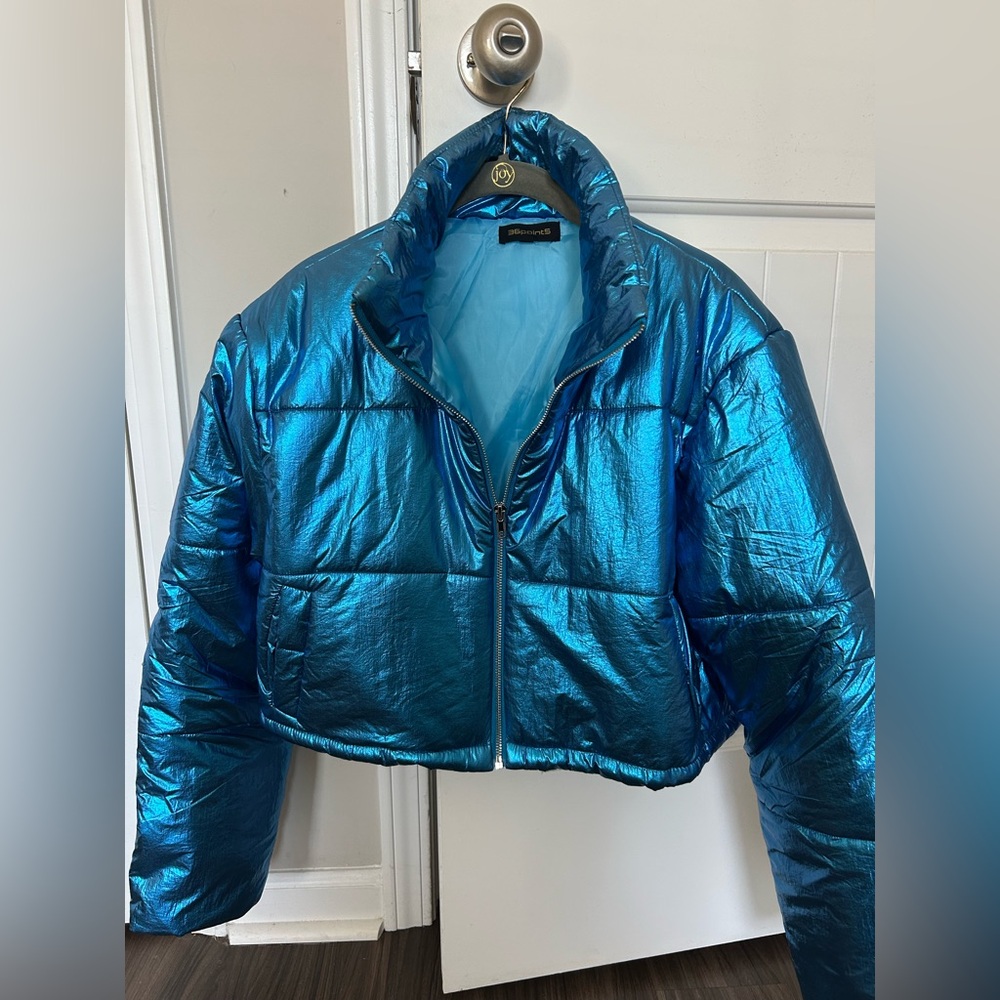 Women’s metallic blue puffer jacket! Size large! Great condition never worn!